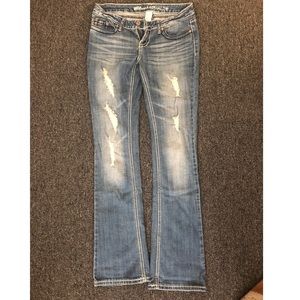 Ripped blue jeans. Size 5